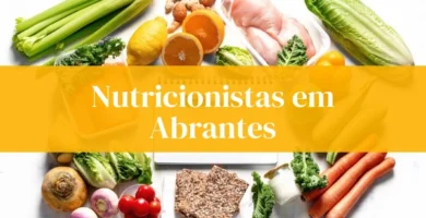 Nutricionistas em Abrantes, frutas e legumes ao redor.