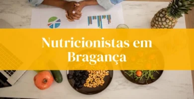 Nutricionistas Bragança alimentos saudáveis mesa com gráficos.