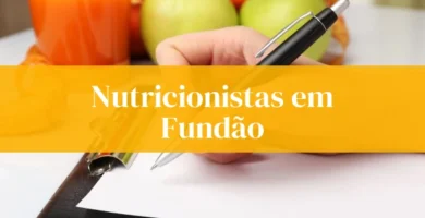 Nutricionistas em Fundão, laranja e maçãs no fundo